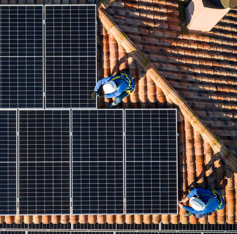 Technicians with solar panels