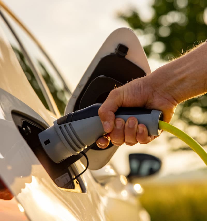 Person charging electric car