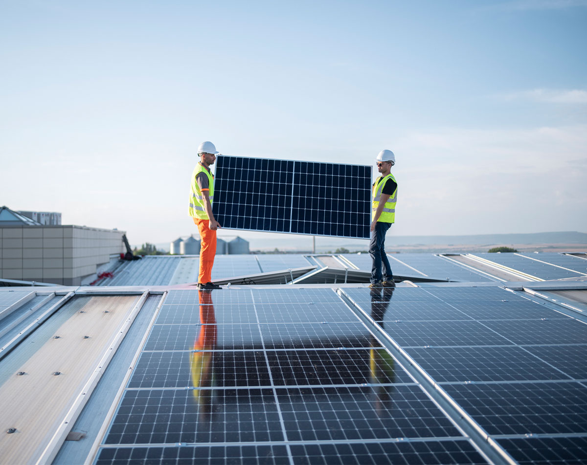 Technicians with solar panels