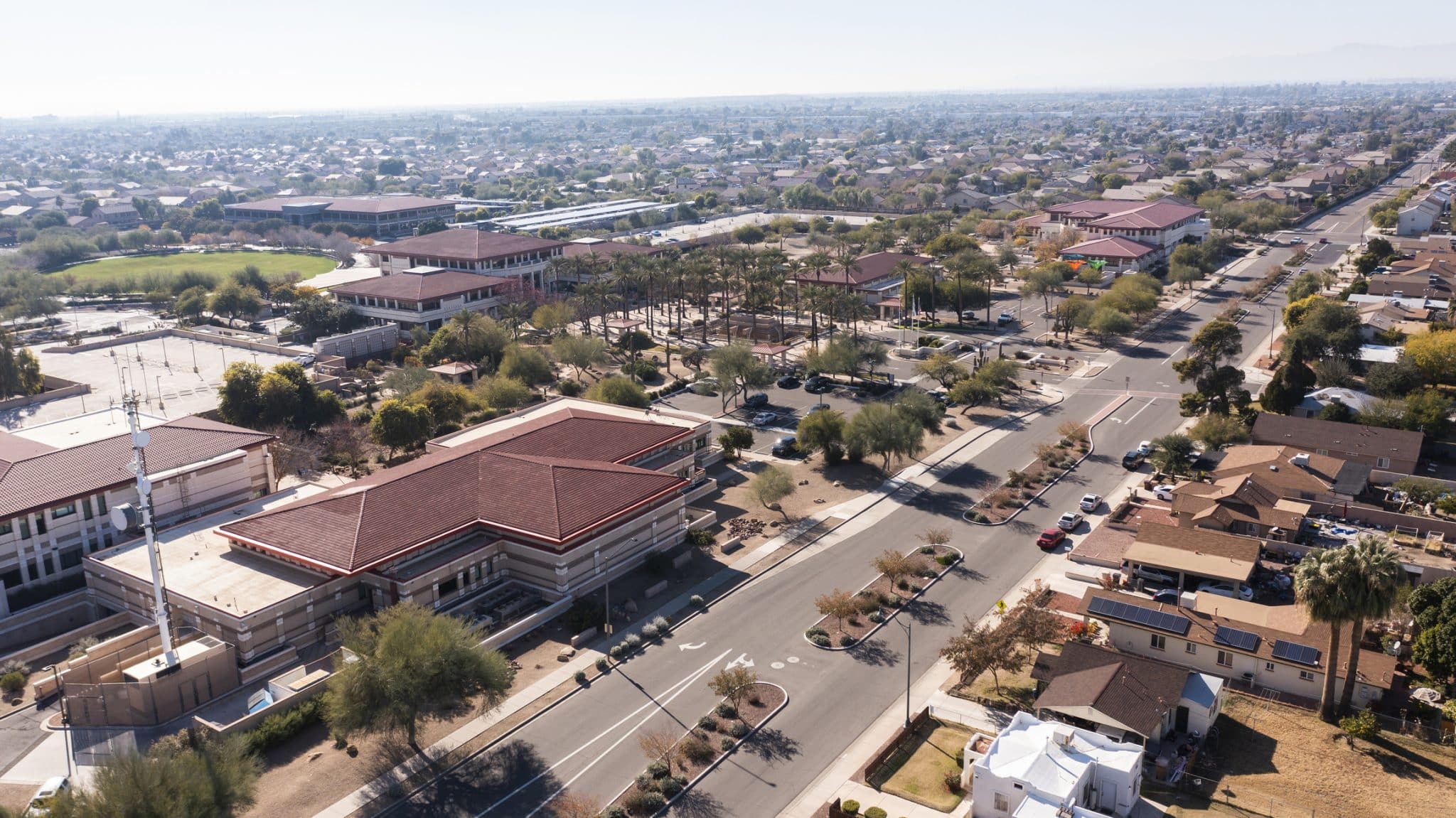 Afternoon aerial view of the downtown skyline and surrounding housing of Peoria, Arizona, USA.